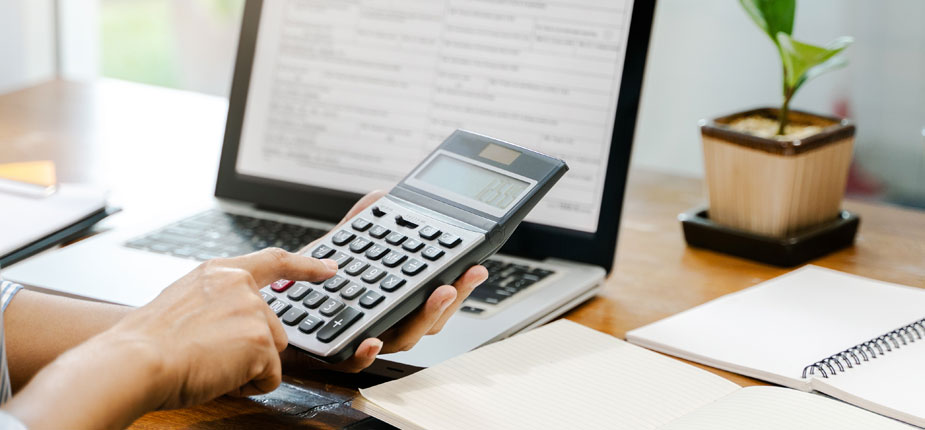 Person doing calculations of how much insurance with an electric vehicle would cost